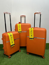 Polo World orange hardside suitcases set of 3