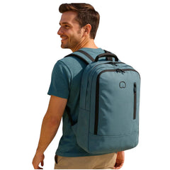 Man wearing Delsey light blue backpack outdoors