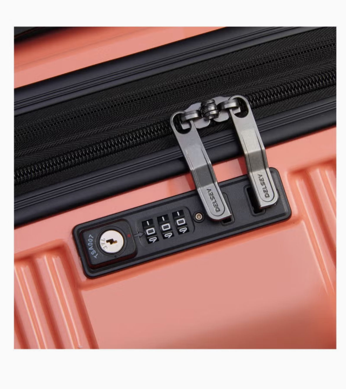 Built-in TSA combination lock on coral Delsey luggage